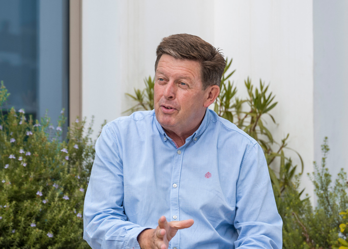 Kevin Jones sat outside in conversation